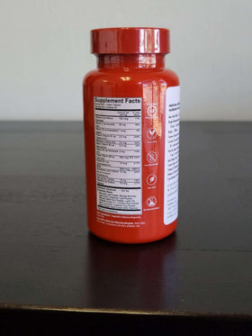 HAIRtamin bottle beside herbs conveying botanical antioxidants and support