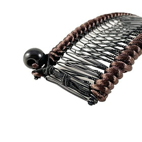 HairZing size comparison in hand demonstrating large capacity for thick hair