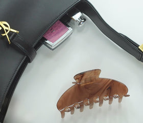 Hana Mia clip on a desk in lifestyle scene for everyday style
