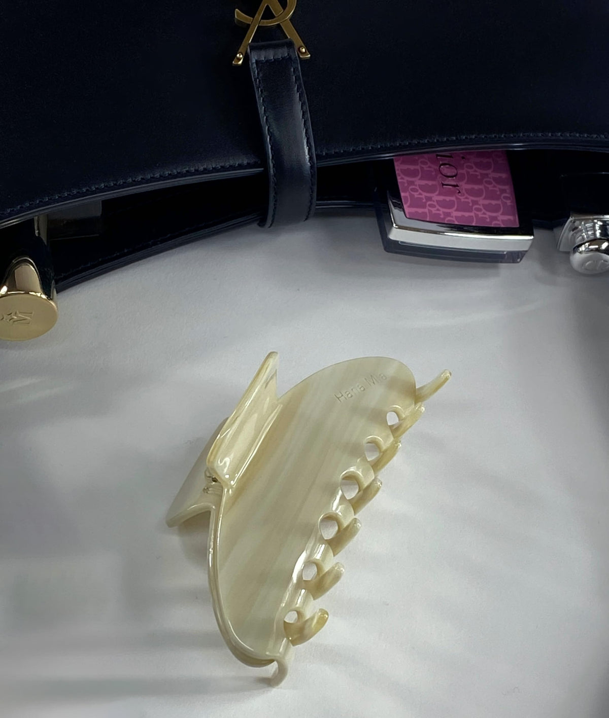 Hana Mia clip in hand for scale showing large 4 inch grip for thicker hair