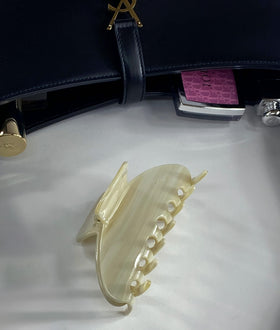 Hana Mia clip in hand for scale showing large 4 inch grip for thicker hair