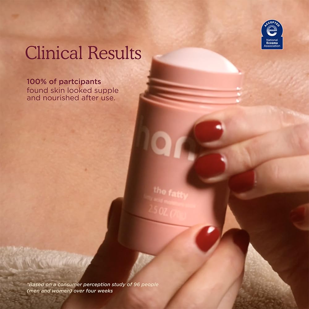 Applying HANNI fatty stick to elbow to hydrate rough patches and reduce dryness