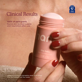 Applying HANNI fatty stick to elbow to hydrate rough patches and reduce dryness