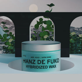 Hand holding Hanz de Fuko 2 oz jar to show compact size and travel convenience