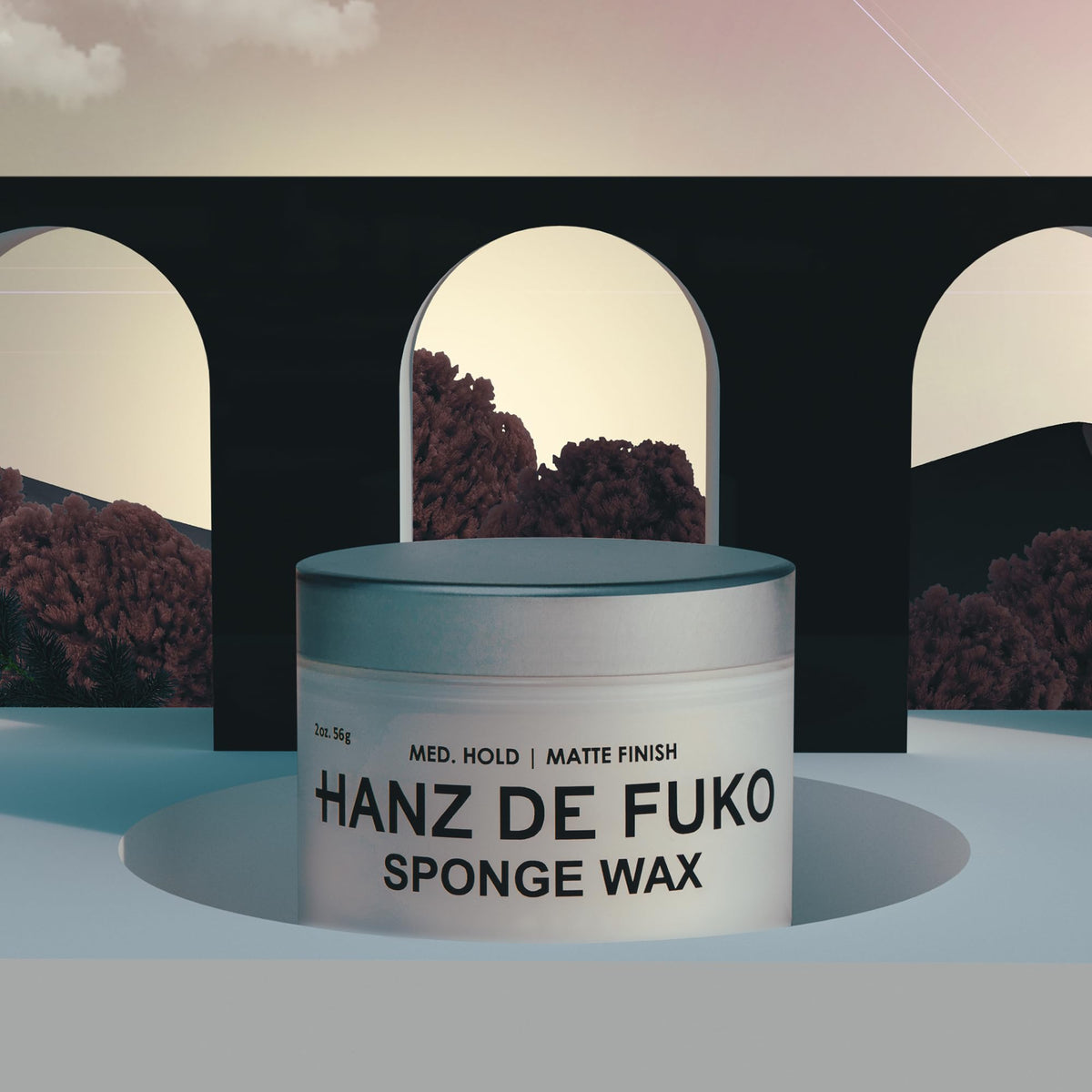 Hanz de Fuko 2 oz jar next to coin for size comparison and travel convenience
