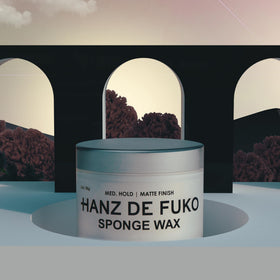 Hanz de Fuko 2 oz jar next to coin for size comparison and travel convenience