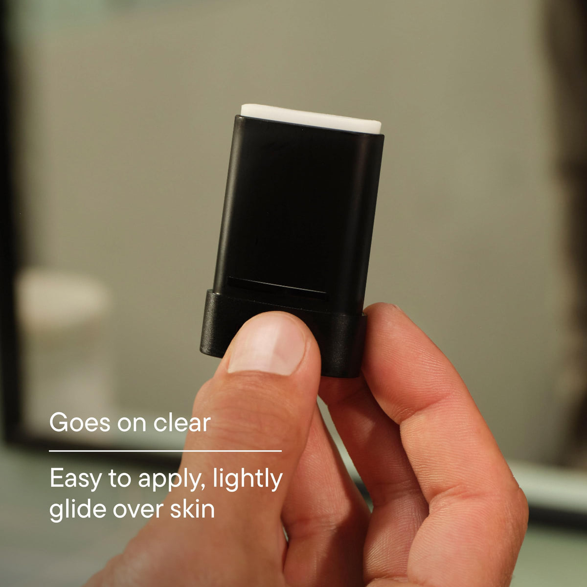 Harry's hand holding the stick to demonstrate compact size and portable utility