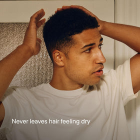 Harry's being applied and combed through wet hair for slick look