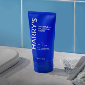 Harry's 4 fl oz tube next to ruler showing true size for travel and daily use convenience