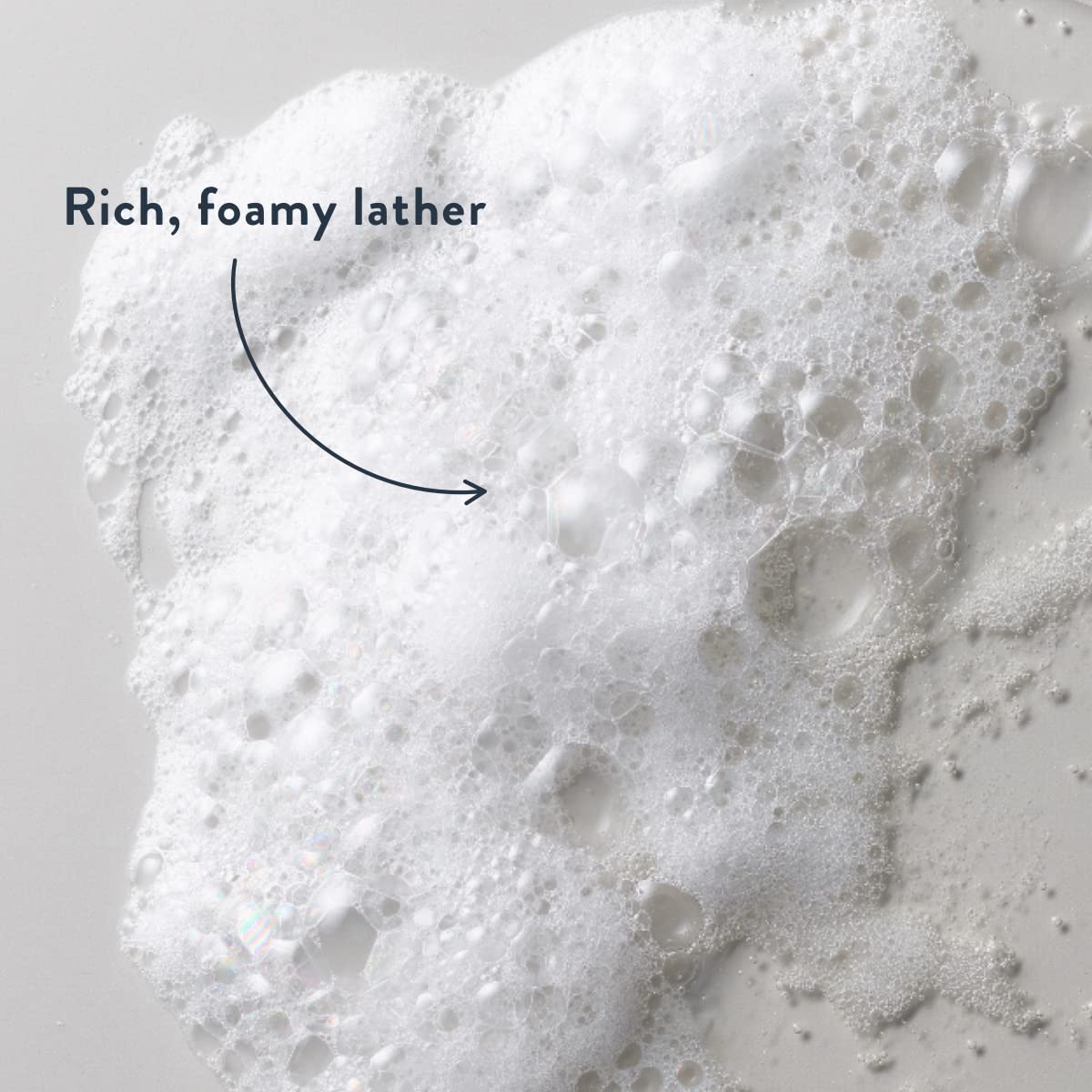 Harry's creamy lather texture on washcloth showing thick foam and gentle cleanse