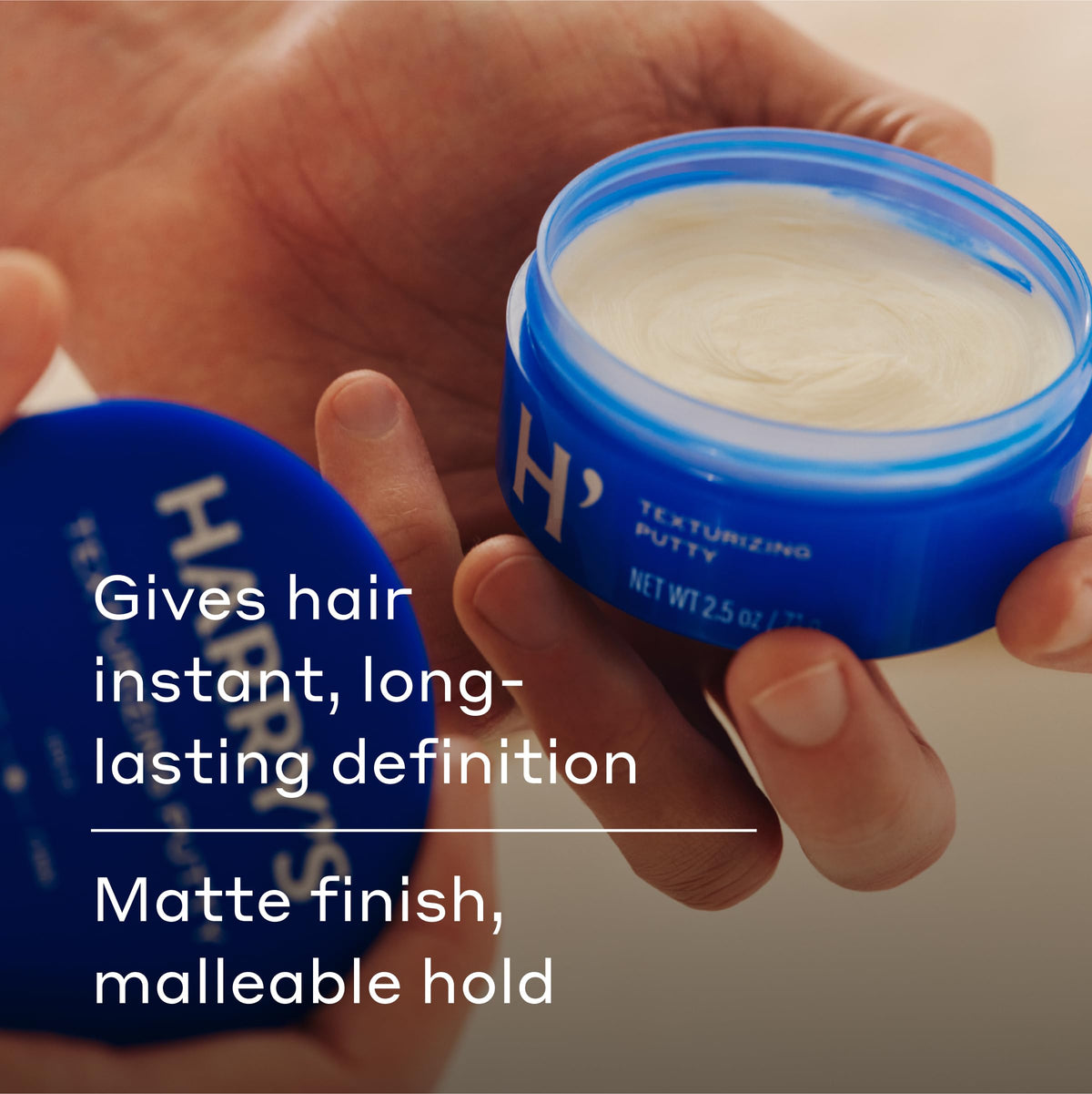 Harry's hands applying putty illustrating effortless styling benefit