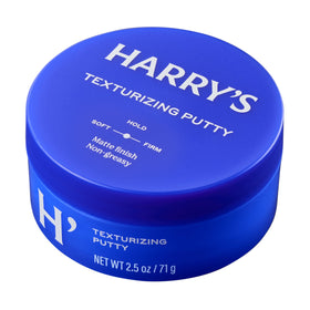 Bathroom shelf with Harry's putty in routine setting conveying everyday grooming use