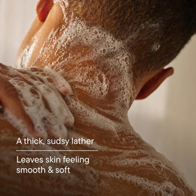 Harry's person using Redwood body wash in the shower for effective cleansing