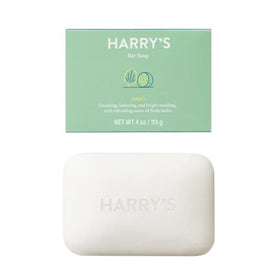 Hand holding Harry's Shiso bar with rich foam showcasing gentle cleansing action