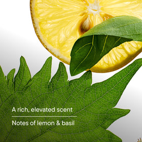 Harry's bottle beside lemon and basil highlighting natural scent notes