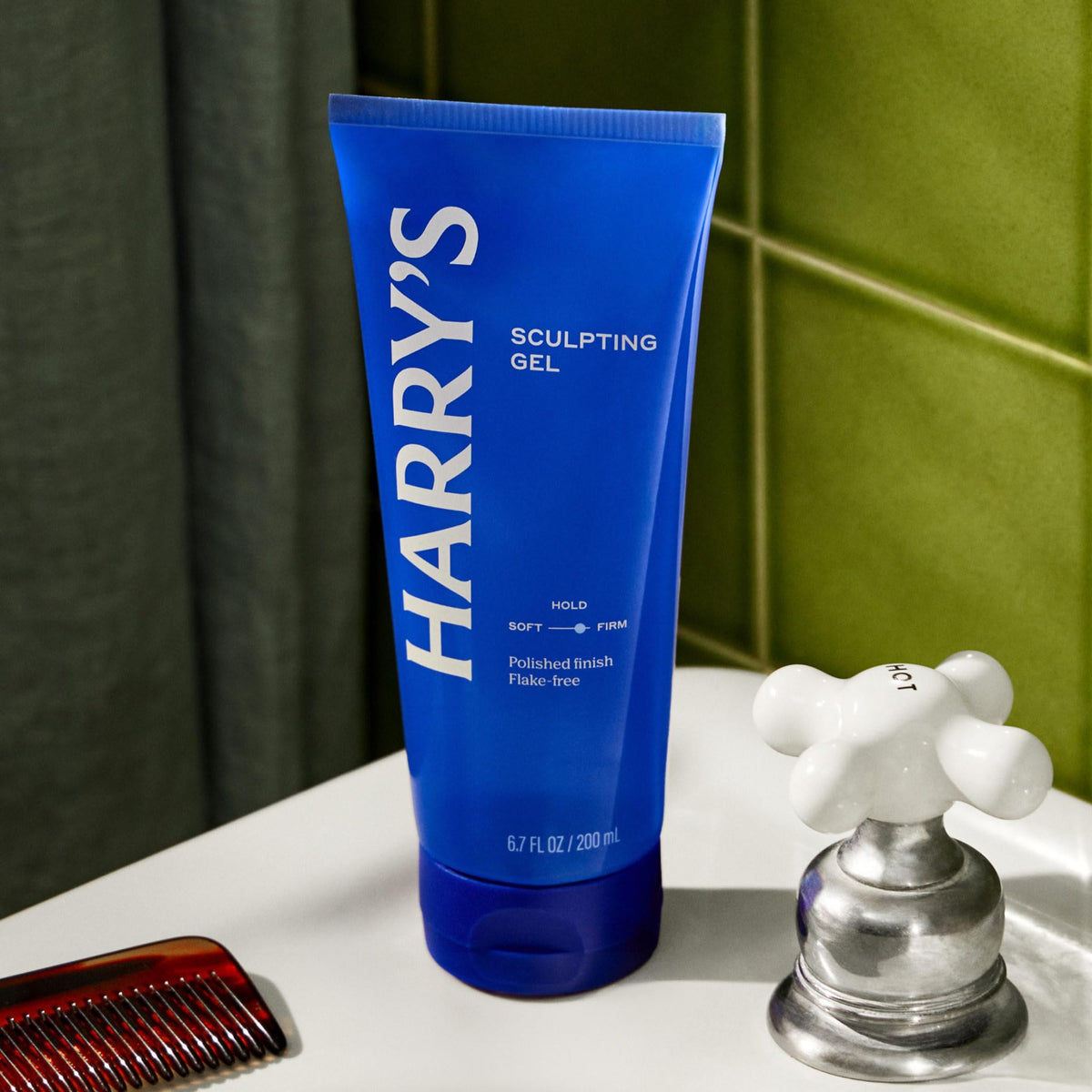 Harry's styled slick-back on model, showing firm hold and natural finish