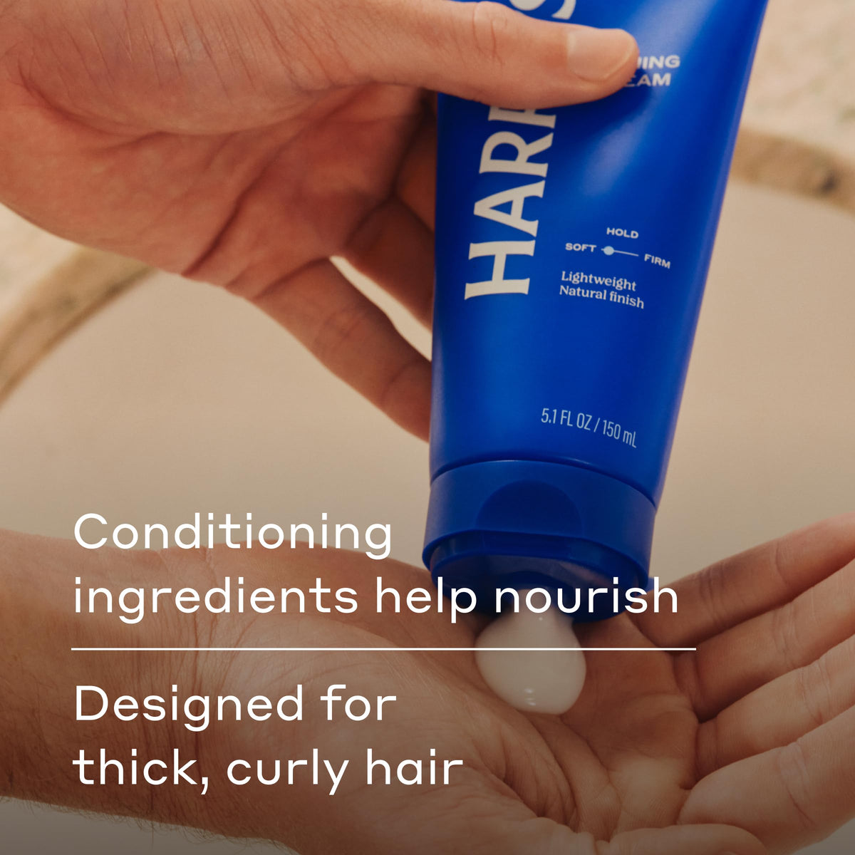 Man styling hair with Harry's cream to show natural finish and reduced frizz benefit