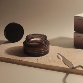 HARUHARU cream next to coin showing 1.6 fl oz size and travel-friendly