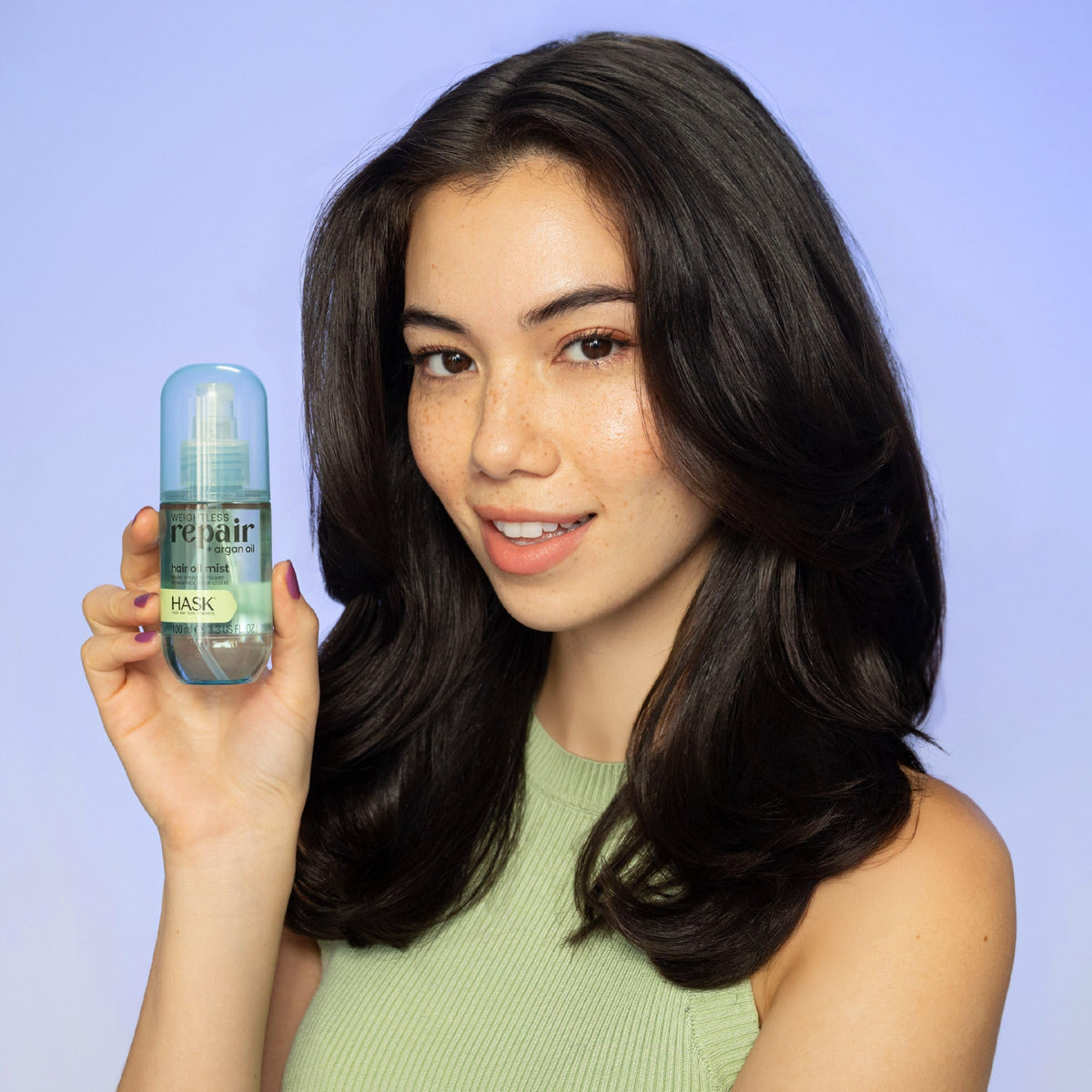 HASK mist being applied to damp hair to lock in moisture and reduce frizz
