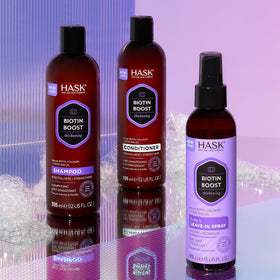 HASK conditioner on bathroom shelf styled with brush and towel