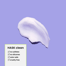 HASK conditioner smoothing through hair to show detangling benefit