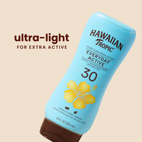 Hawaiian Tropic lotion texture close-up showing lightweight, non-greasy feel