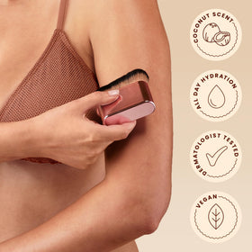 Hawaiian Tropic bottle on beach towel in lifestyle scene suggesting tropical scent appeal