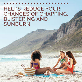 Hawaiian Tropic lip balm in use at beach demonstrating water-resistant protection during outdoor activity