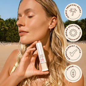Hawaiian Tropic powder applied over makeup to set foundation and protect