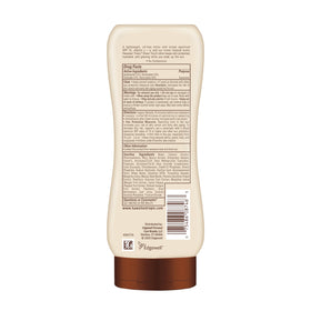 Hawaiian Tropic bottle in beach setting conveying tropical scent