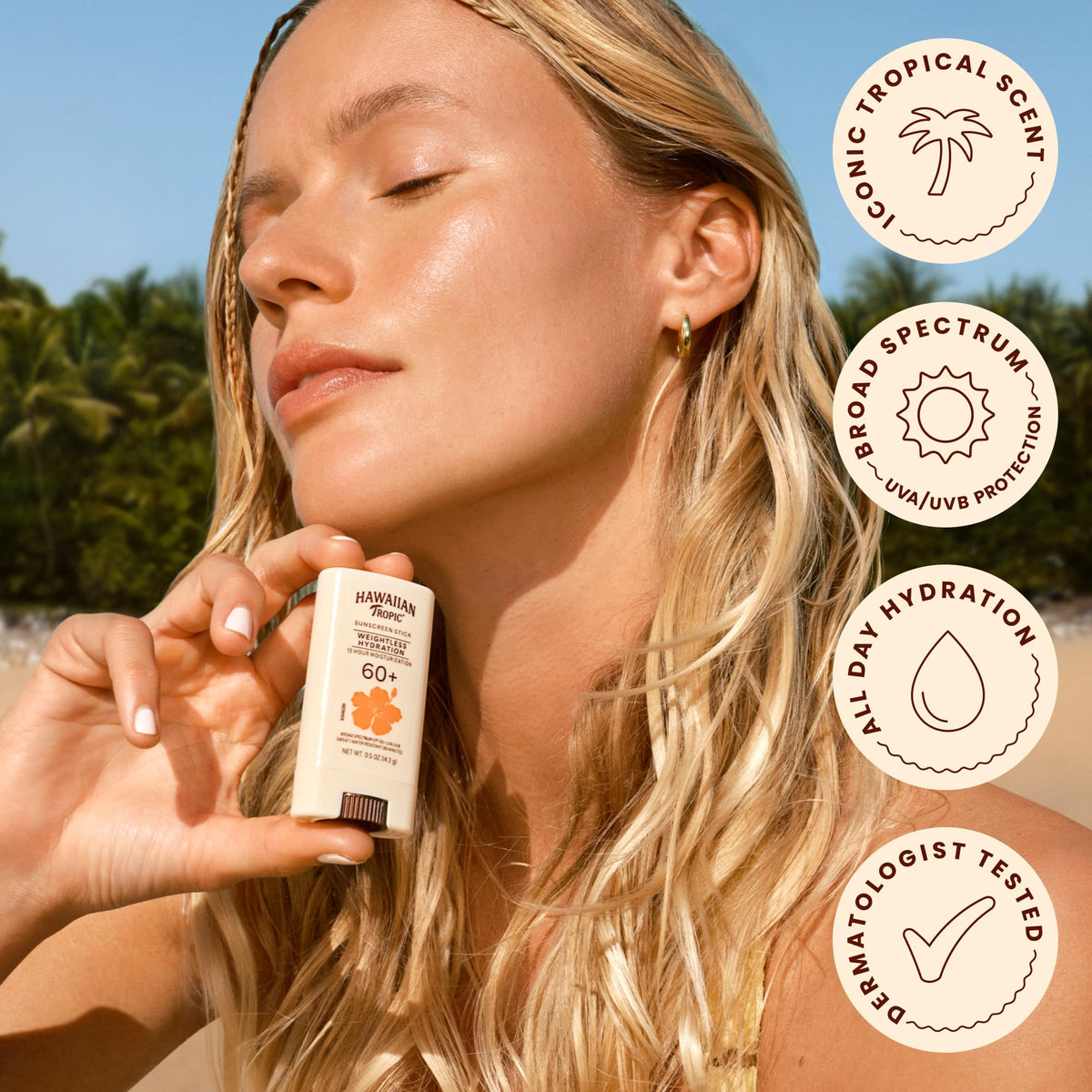 Hawaiian Tropic stick next to coin showing compact 0.5oz portability benefit