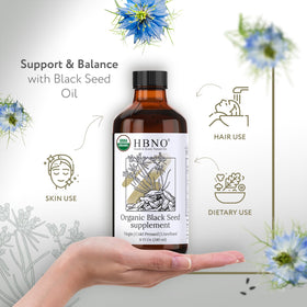 HBNO pouring oil closeup illustrating smooth cold‑pressed texture