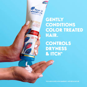 Head & Shoulders bottle in hand for size comparison and travel convenience
