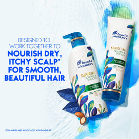 Argan and jojoba oils near Head & Shoulders bottle illustrating nourishing ingredients