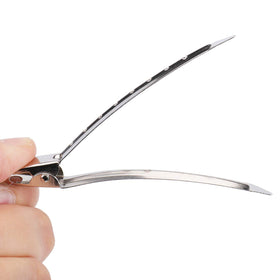 Hedume clips in hand demonstrating 3.5 inch scale and secure grip