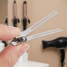 Hedume clips held in hand to show 1.8-inch scale and easy handling benefit