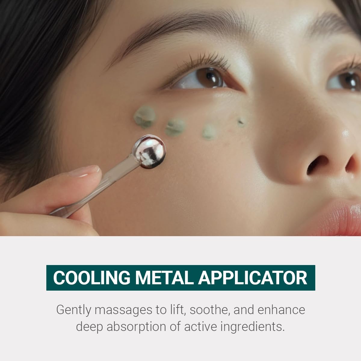 HEIMISH applying cream under eye with metal massage, reduces swelling