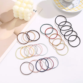 Helamvly hair tie beside ruler showing 1.57 inch diameter scale