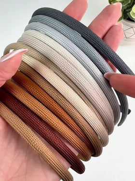 Heliums single band profile showing narrow curve and flexible plastic base for secure fit