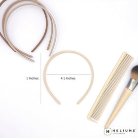 Heliums stacked headbands beside coin for size comparison showing slim 8mm profile convenience
