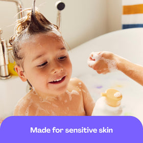 Baby in bath using Hello Bello two-in-one for quick, soothing clean-up