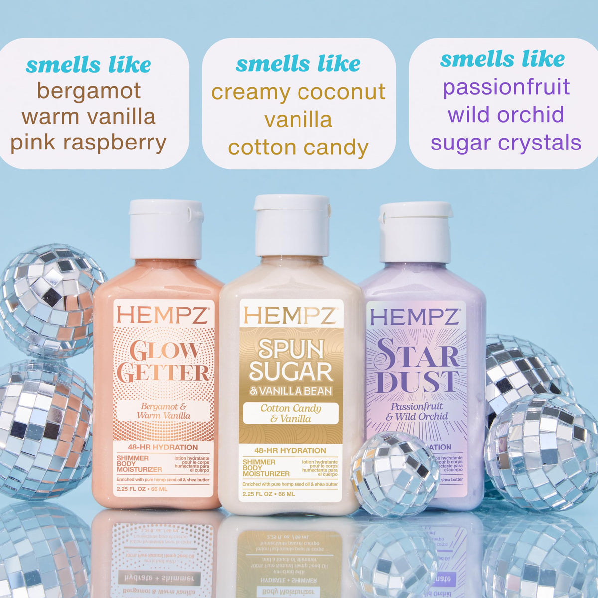 Hempz trio arrangement of Glow Getter Star Dust Spun Sugar displaying color and bottle design benefits