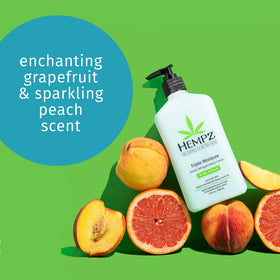 Hempz crème being scooped and applied to skin demonstrating smooth spreadability