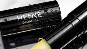Henné Organics metal tube detail showing durable design and luxe finish