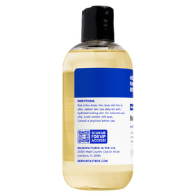 Her Fantasy Box poured drops on hand illustrating silky texture and hydration