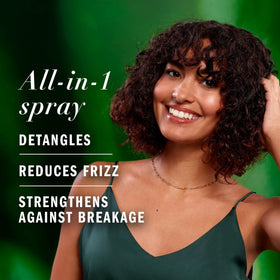 Herbal Essences being misted onto damp hair for detangling and softness