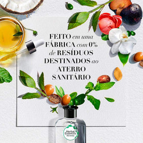 Herbal Essences conditioner in hand showing bottle size and scale