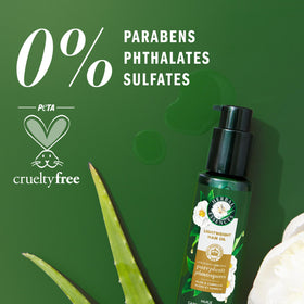 Dispensed oil bead on fingertip demonstrating Herbal Essences quick-absorbing texture