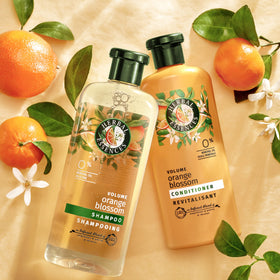 Herbal Essences shampoo lather in sink demonstrating quick-rinse performance