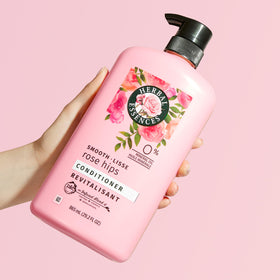 Herbal Essences bottle in hand to show size and 29.2 fl oz capacity